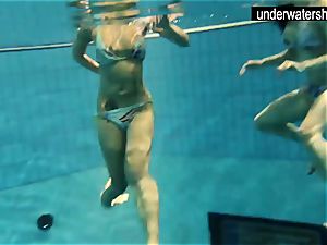 2 sexy amateurs showcasing their figures off under water